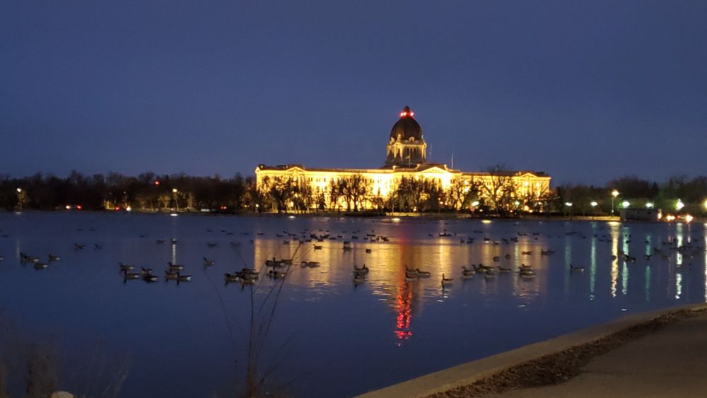 Legislature and geese at night on the lake