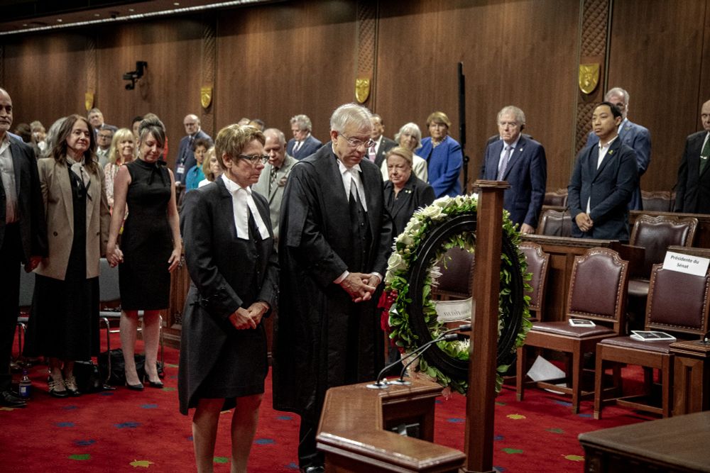 The Speaker of the Senate and the Speaker of the House of Commons lay a wreath in memory of the late parliamentarians.