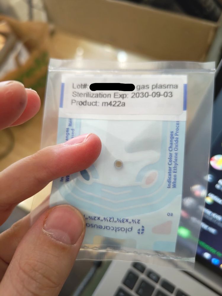 Picture of me holding the sterile bag for a m0422a magnet from Dangerous Things