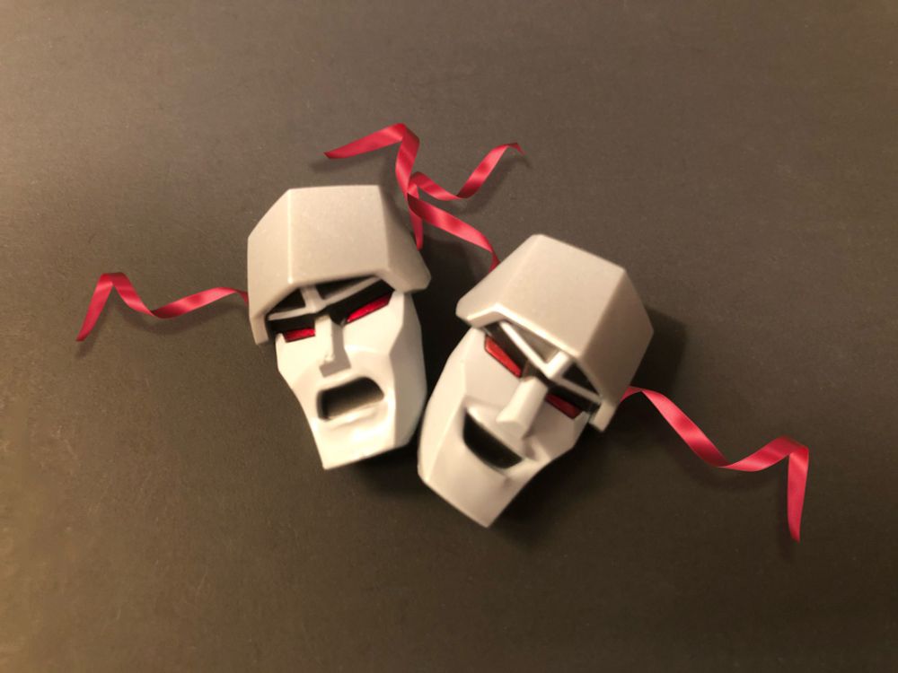Thalia and Melpomene masks except it's Megatron's faces instead.