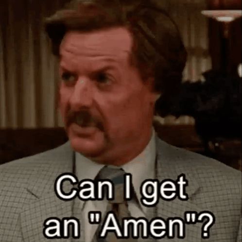 a man in a suit and tie says can i get an amen