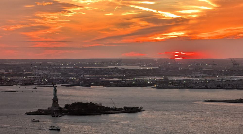 A view of New York Harbor at sunset viewed from lower Manhattan