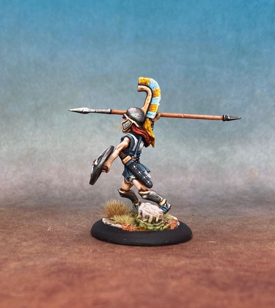 Far side view showing her decorate scabbard and red hair.