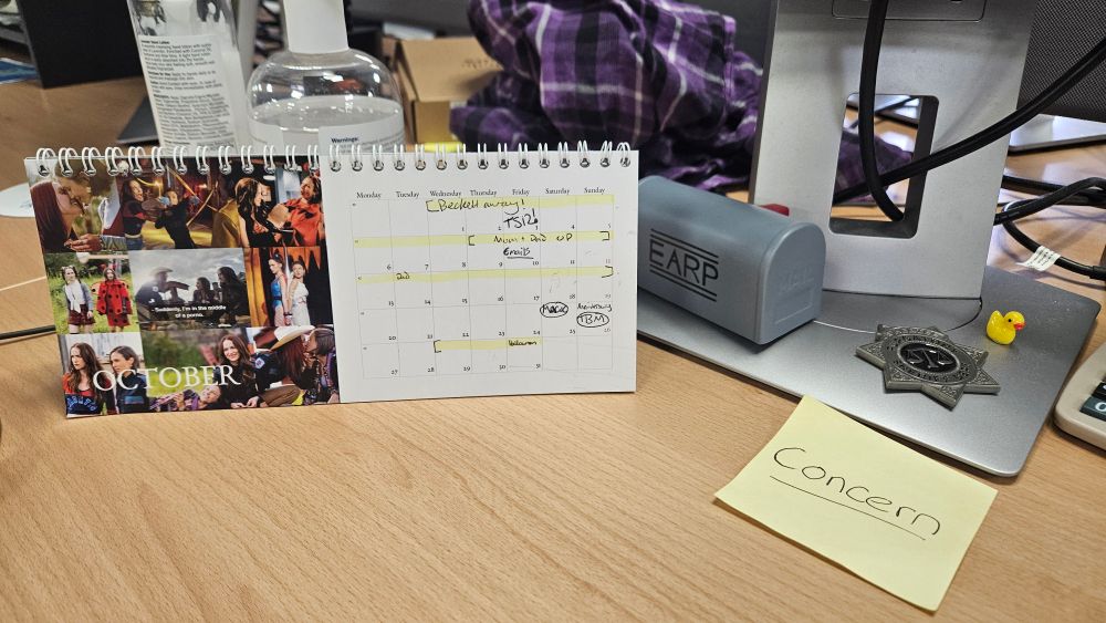 A calendar on a work desk. The post it note reads 'concern' which is an in joke at work