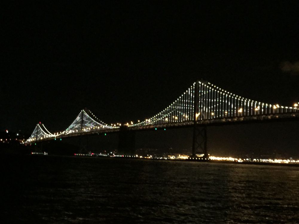 Bay Bridge with its lights on at night