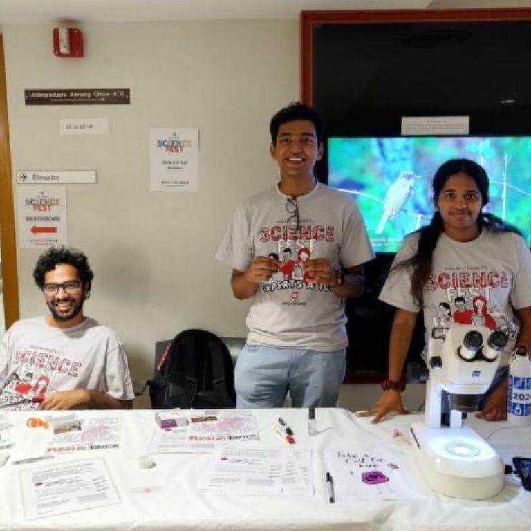 Siddhartha Yaddanapudi, Josy Joseph, and Anjaly Prasannajith engage visitors during Science Fest as part of IU Biology's outreach efforts.