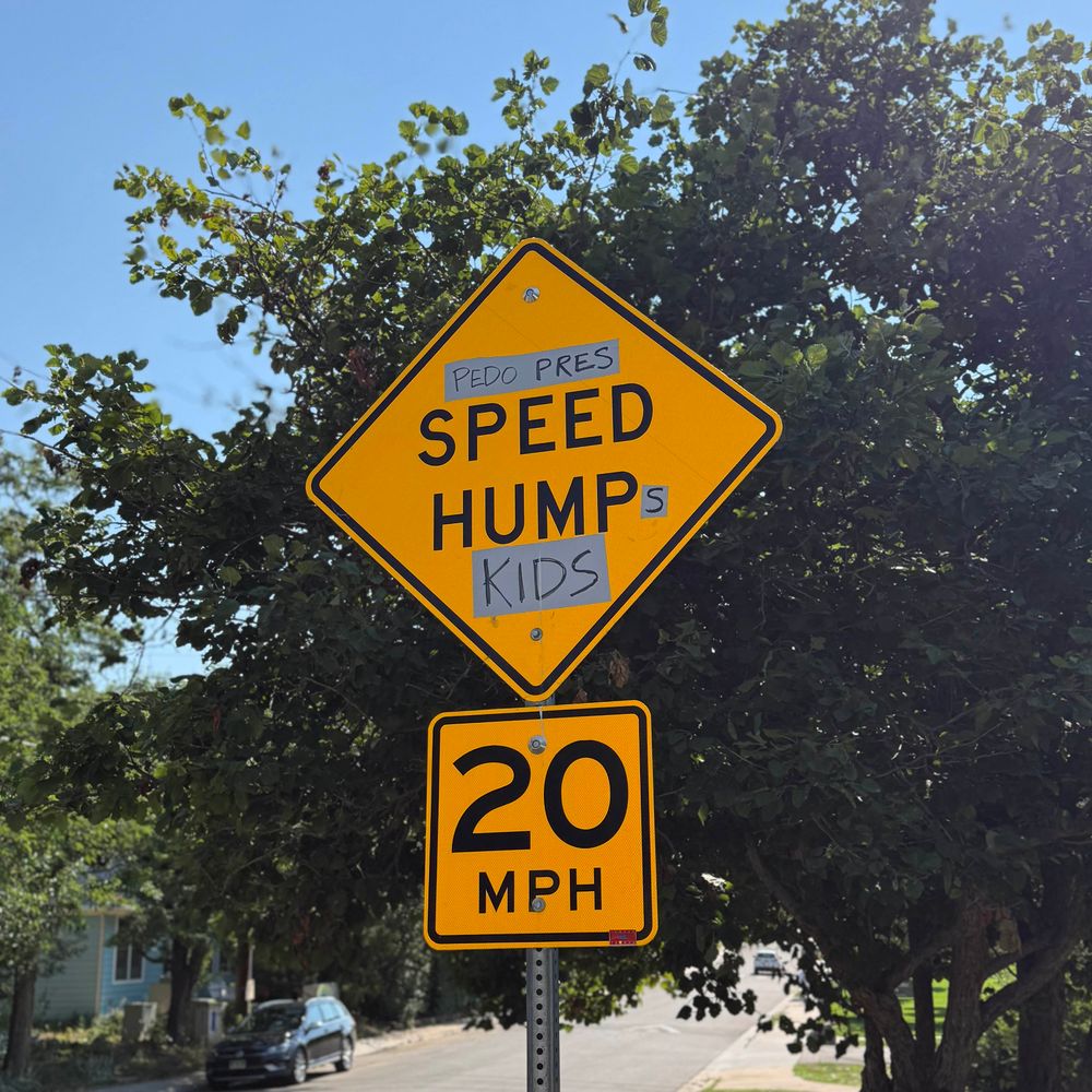 Sign vandalized to read “Pedo Pres SPEED HUMPs Kids”