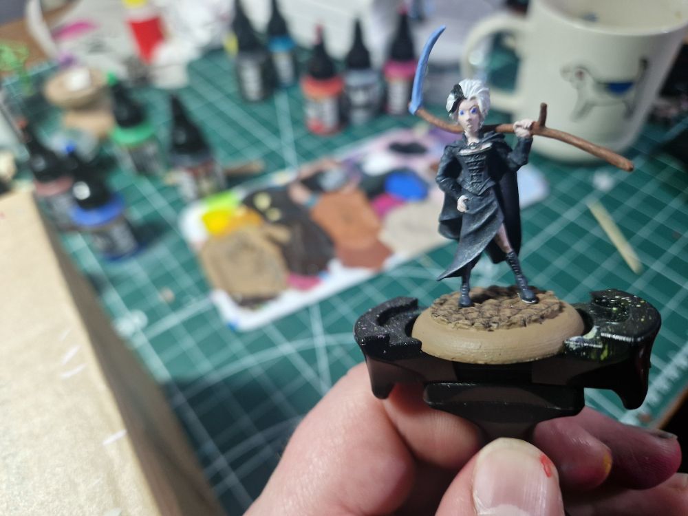 Miniature of questionable paint work of Susan Sto Helit from Terry Pratchett's Discworld book series.