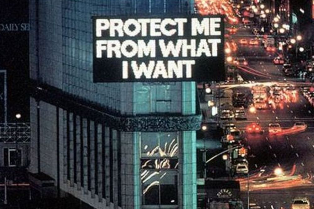 Jenny Holzer billboard from Times Square that reads, 'Protect Me From What I Want'