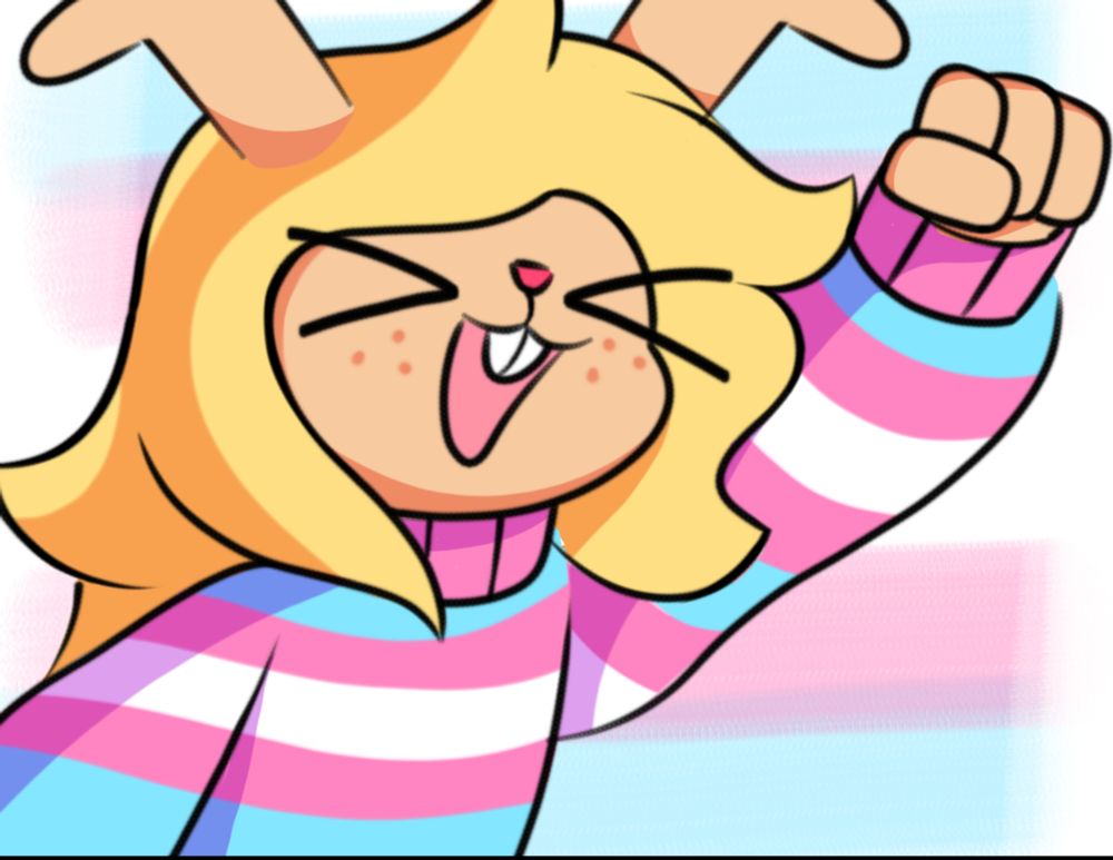 Noelle Holiday rising her fist onto the air, closing her eyes and opening her mouth wide.