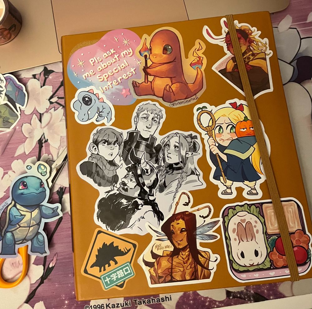New sketchbook with amazing stickers from artists I found at comic con - happy to try and provide artist names if asked! 