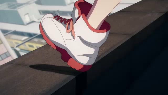 a person wearing a pair of white and red shoes is walking on a ledge