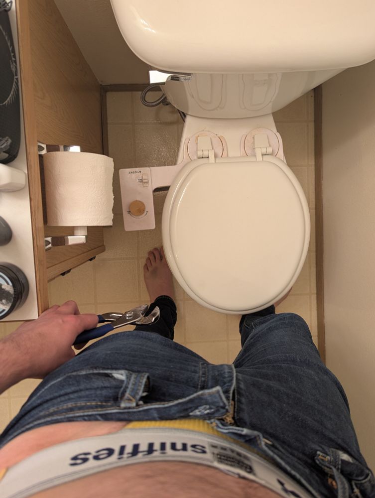 completed bidet pic with wrench and feet in view
