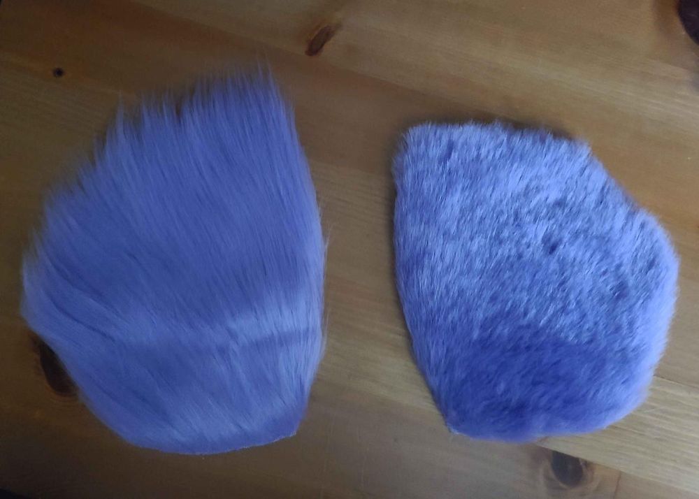 Two mirrored pieces of faux fur; the left side is long and unshaved, the right shaved and trimmed very short.
