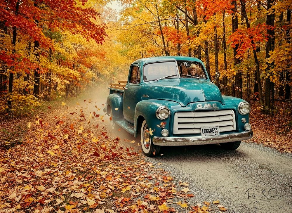 A blend of my phone photograph of a vintage truck taken in a parking lot, which is then merged into an AI generated fall country road. 