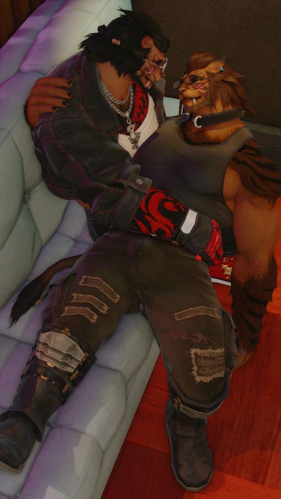 Two hrothgar are resting together on a couch, gazing at each other happily and lovingly.