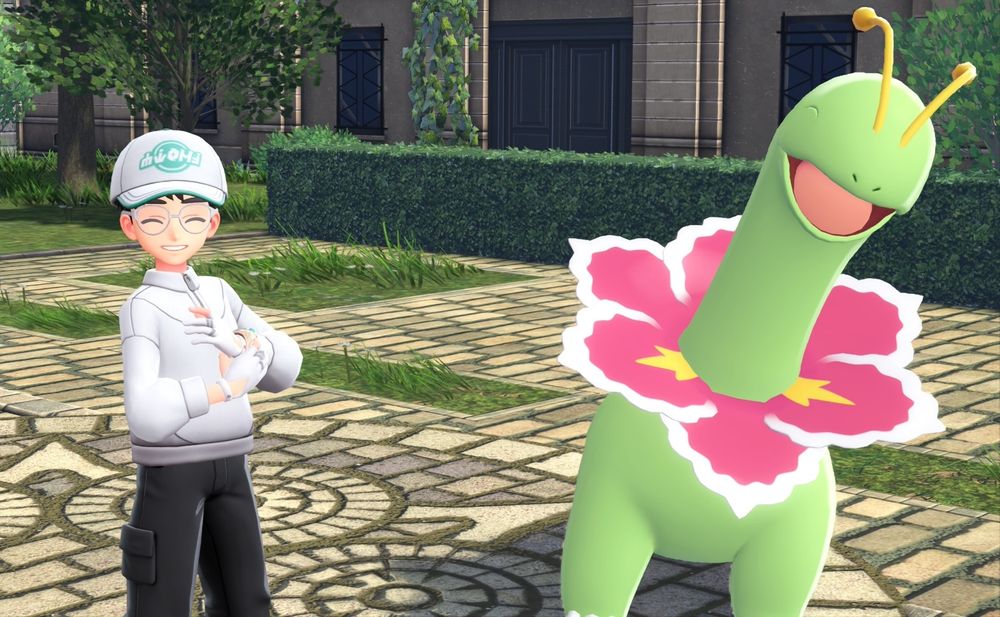 Me and Meganium smiling in the Hotel Z courtyard