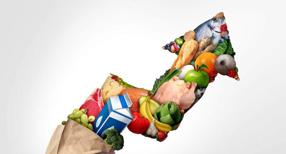 Image shows groceries arranged in the shape of an upwards arrow