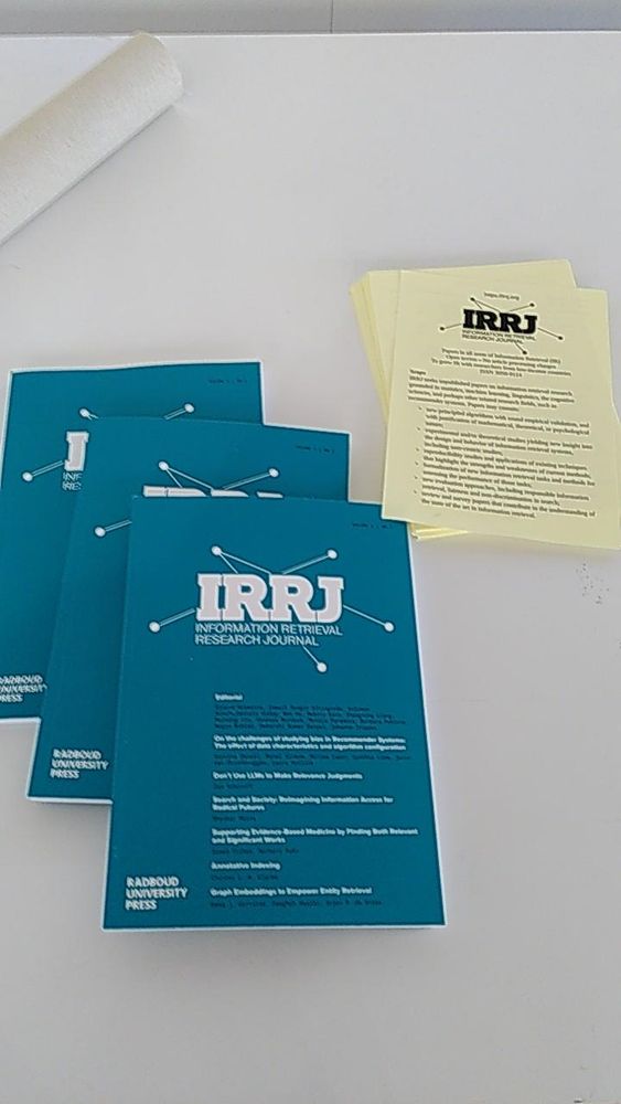 Stack of IRRJ first issues and flyers on table