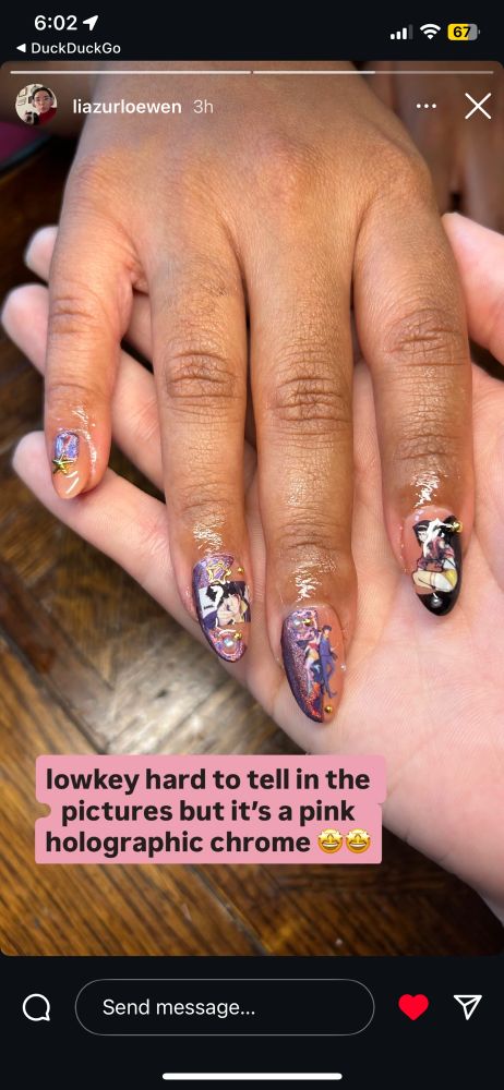 My right hand lays atop my friend, Lea’s, paler hand. Manicure has Cowboy Bebop nail decals. Thanks for the great manicure, girl. 