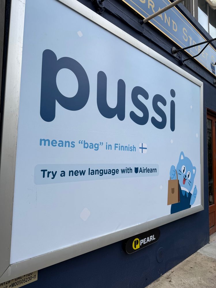 Wall ad “pussi means bag in Finnish” 