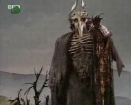 Evil character from Through the Dragons Eye. Dark and cloaked, some sort of animal skull on his head, bones claws and exposed ribs