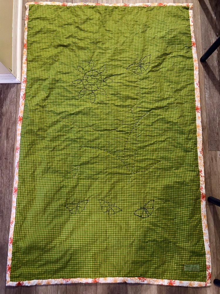 Handmade quilt. Floral panel with green border. Green backing, all hand stitched. 