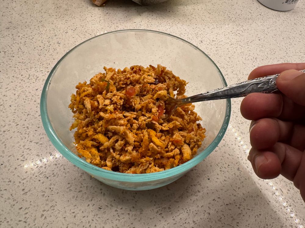 Tofu shredded with a box grater and cooked with taco seasoning. 