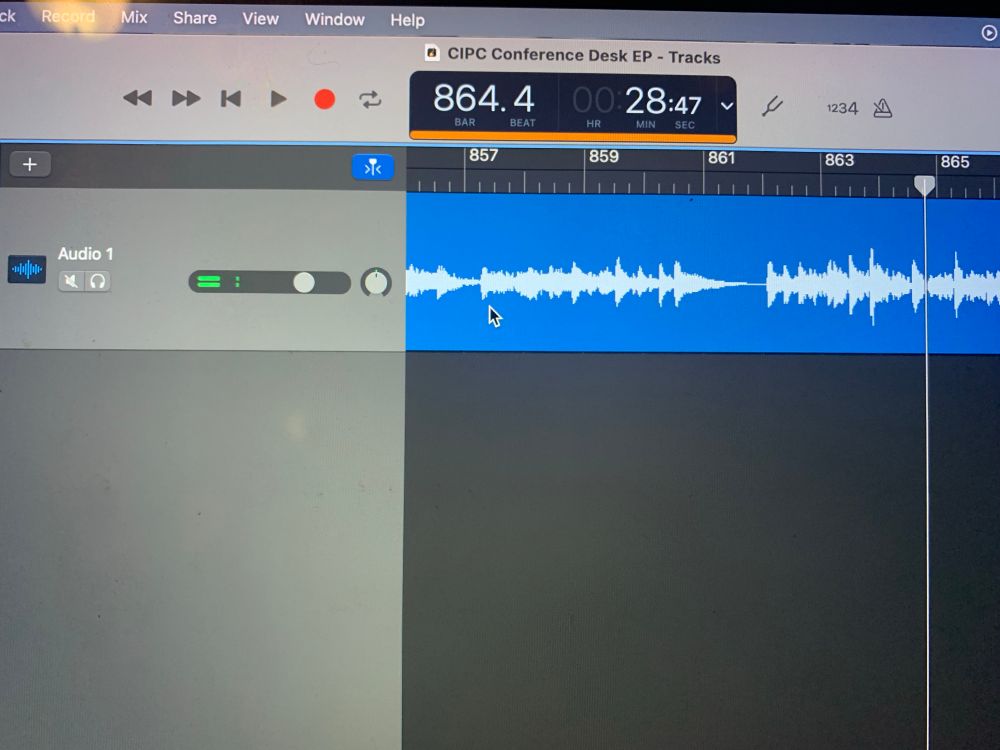 A screenshot of GarageBand (a music app) showing an image of an audio track with the waveforms of the audio to the right. Across the top is the name of the file: “CIPC Conference Desk EP”