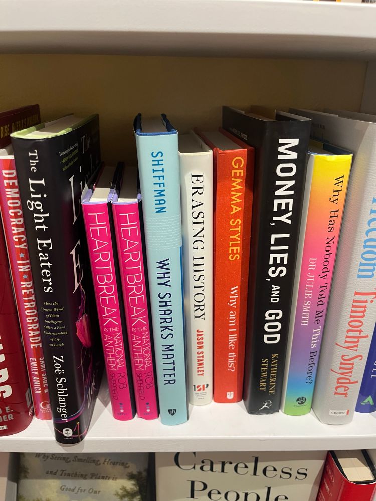 Books on a bookshelf, including 