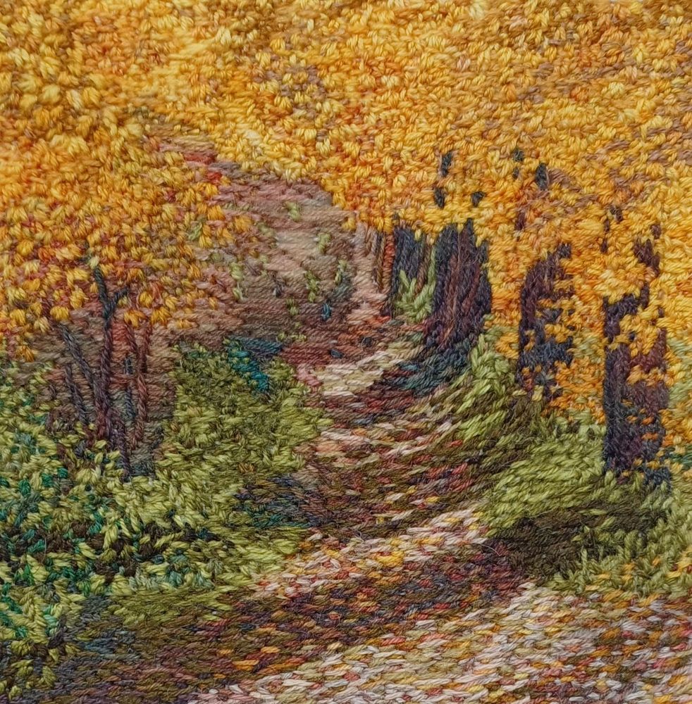 Stitched artwork depicting a path through beech woodland which resembles a tunnel