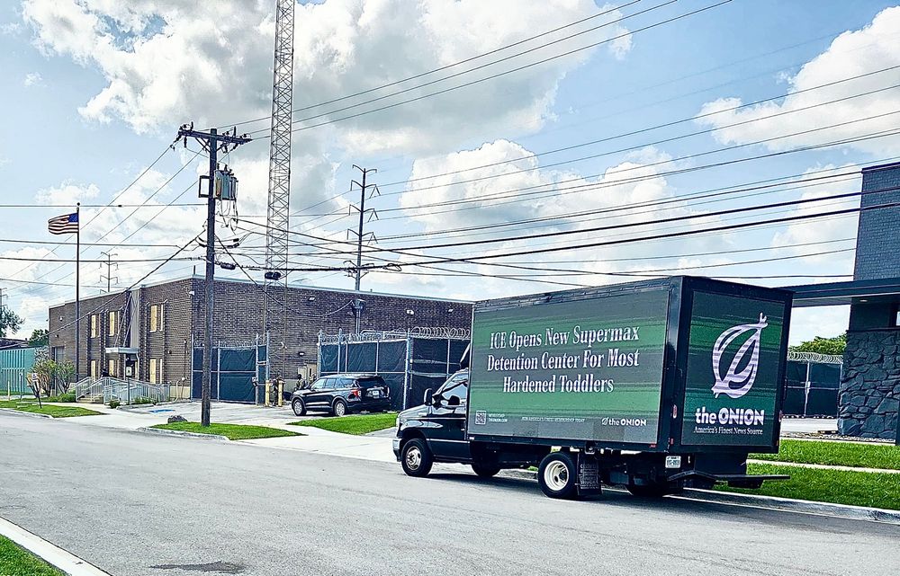 The Onion News Network truck featuring the headline ICE Opens New Supermax Prison for Most Hardened Toddlers stationed outside the ICE facility.