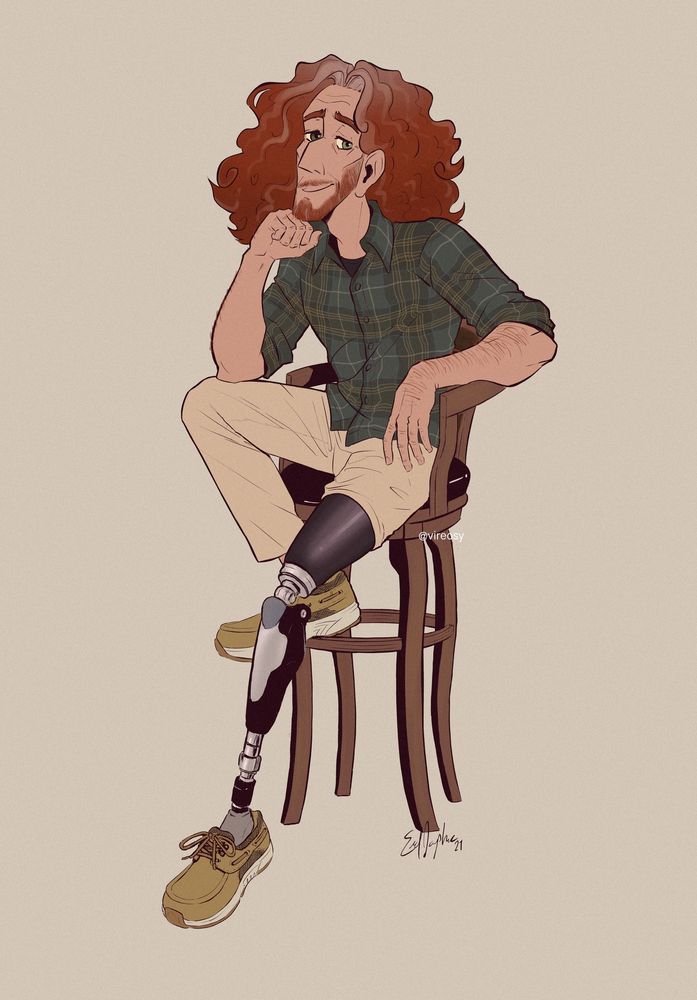 Portrait of Ryland sitting on a barstool. He has a green tartan shirt and khaki pants, one leg rolled up to display a prosthetic.