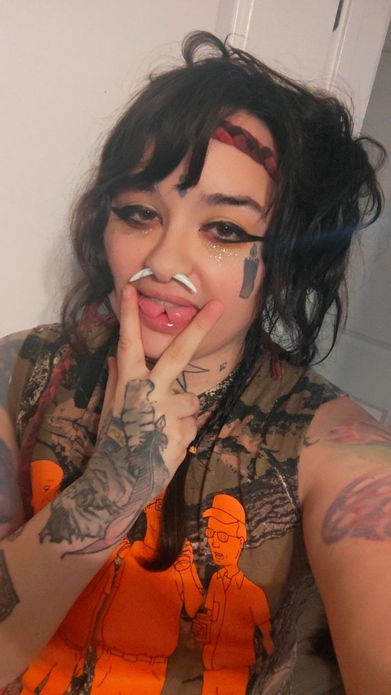 Same person doing the lesbian tongue sign but with a split tongue