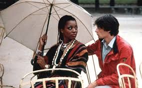 The two main characters of the French movie Diva seated at Cafe tables