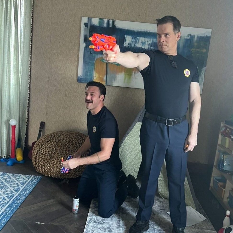 ryan guzman and peter krause, Peter is holding a nerf gun 
