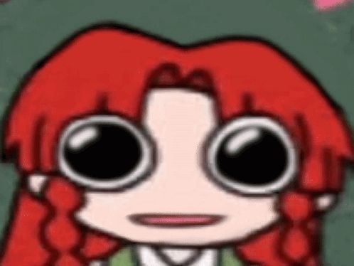 a cartoon character with red hair and big eyes is wearing glasses .