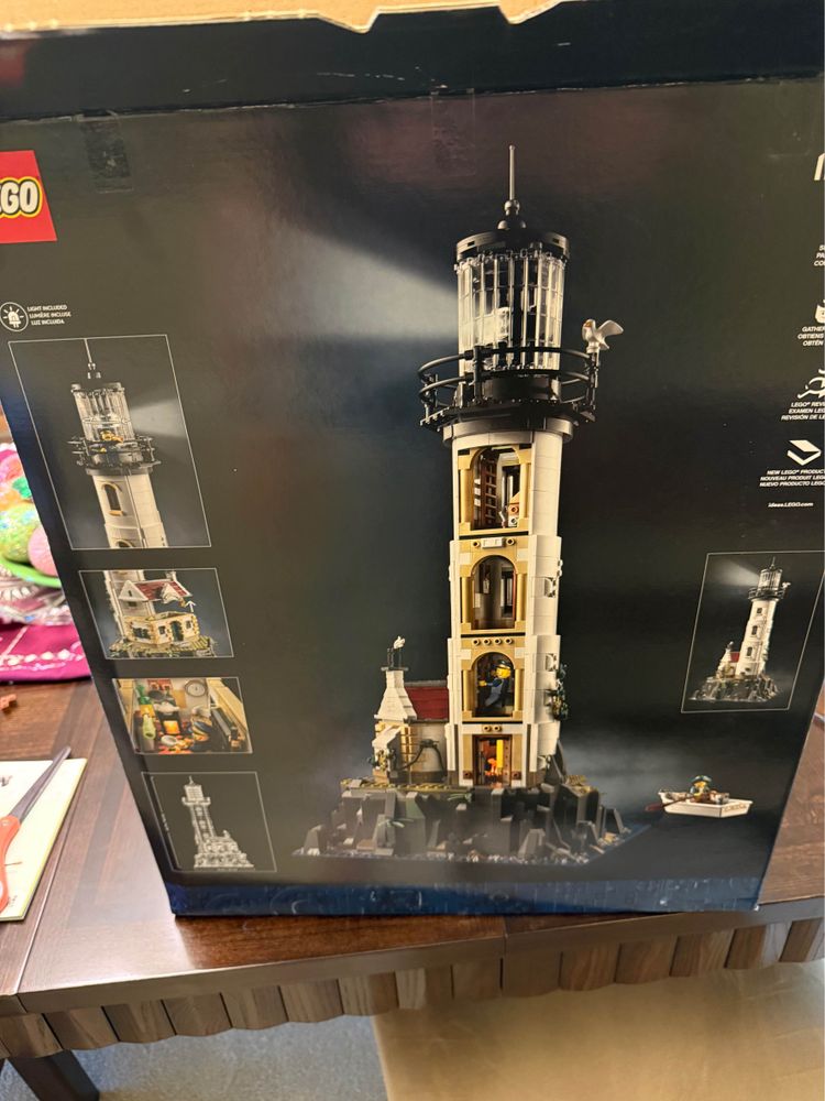 Box for the Lego lighthouse set sitting on a table. 