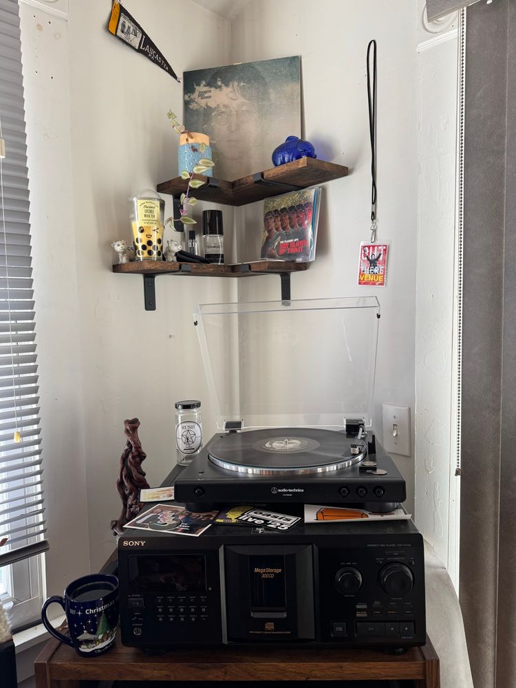 A turntable setup with John Lennon’s album Imagine on the platter. 