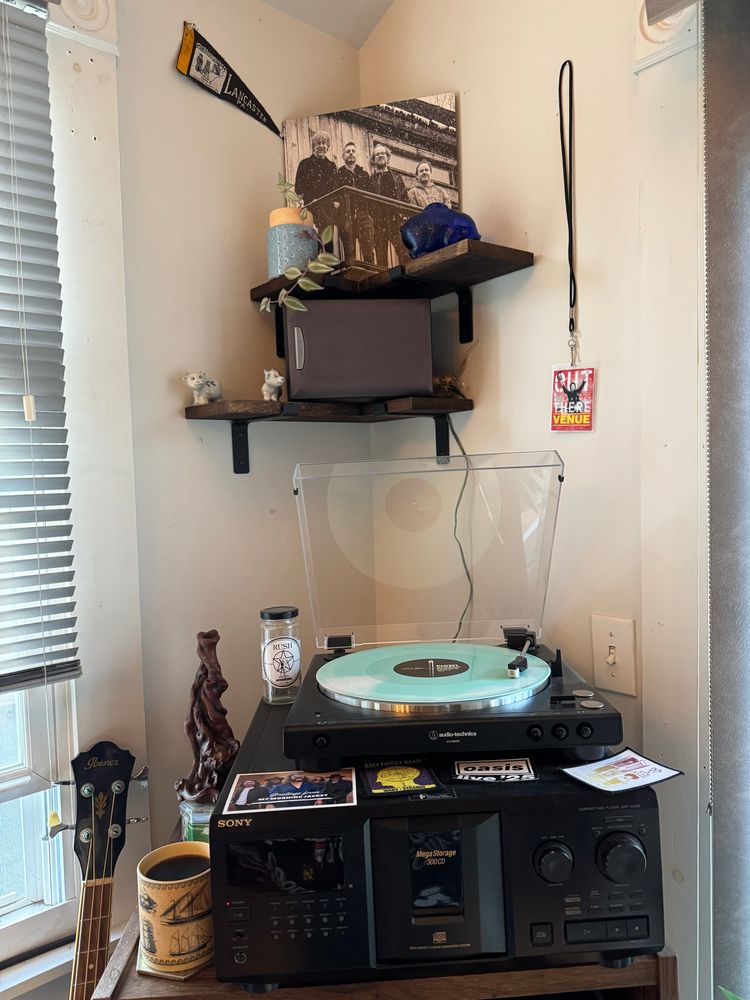 A turntable setup with Phish’s album Sigma Oasis on the platter. 