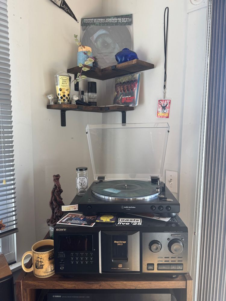 A turntable setup with Roger Waters’ album Amused to Death on the platter. 