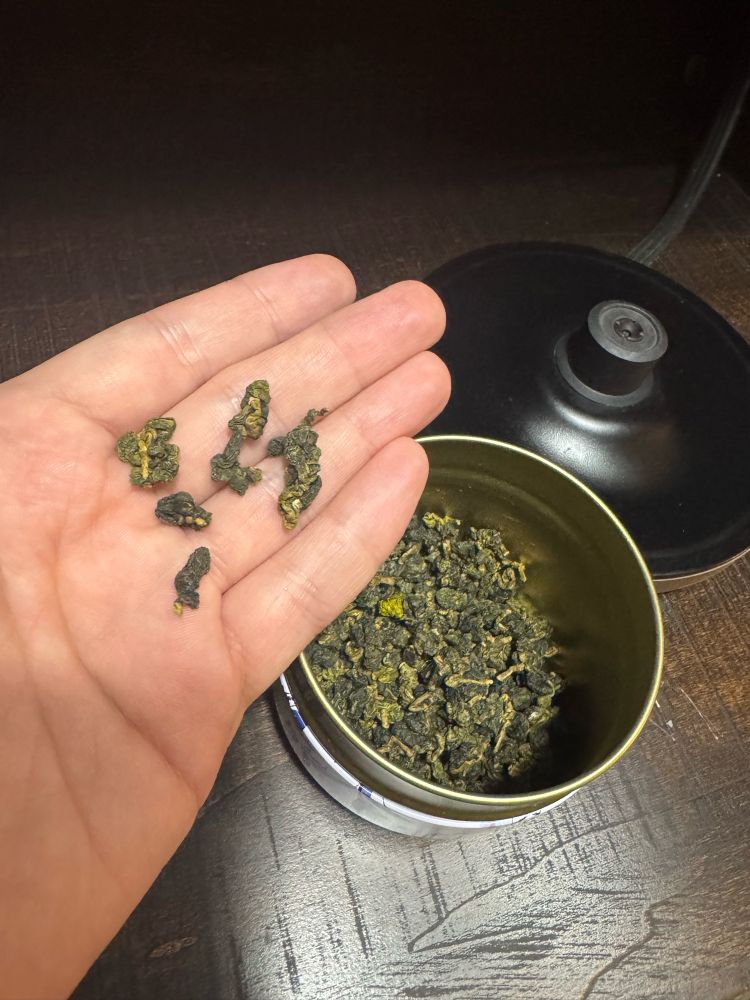 Dry tea leaves, pretty small. 