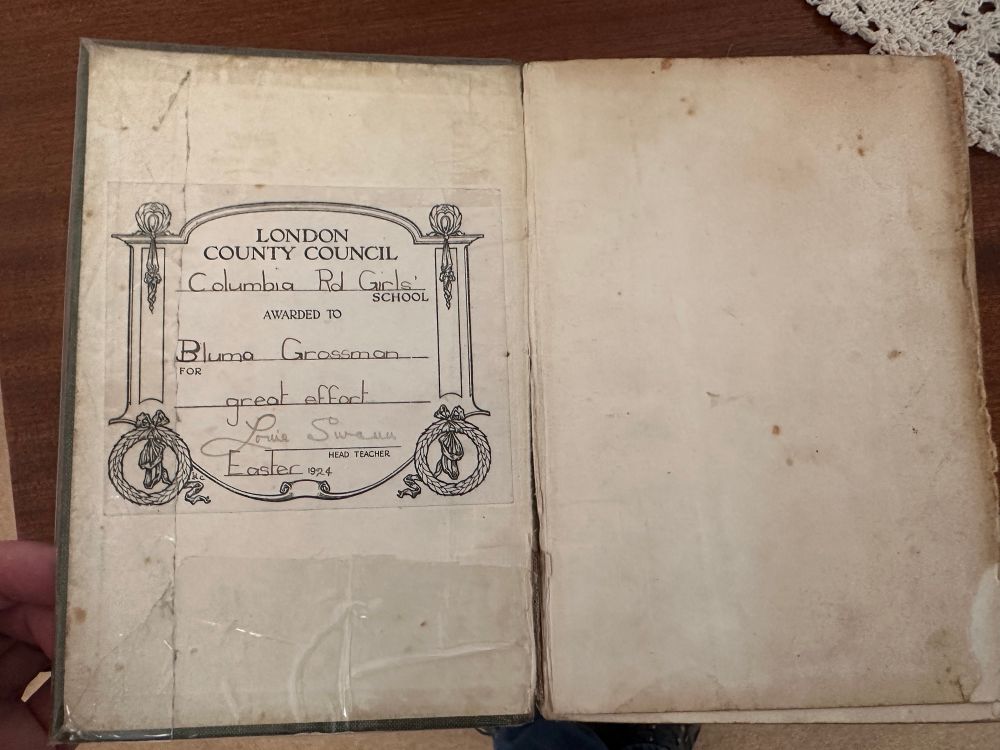 An open copy of Longfellow was a presentation plate dated 1924. 