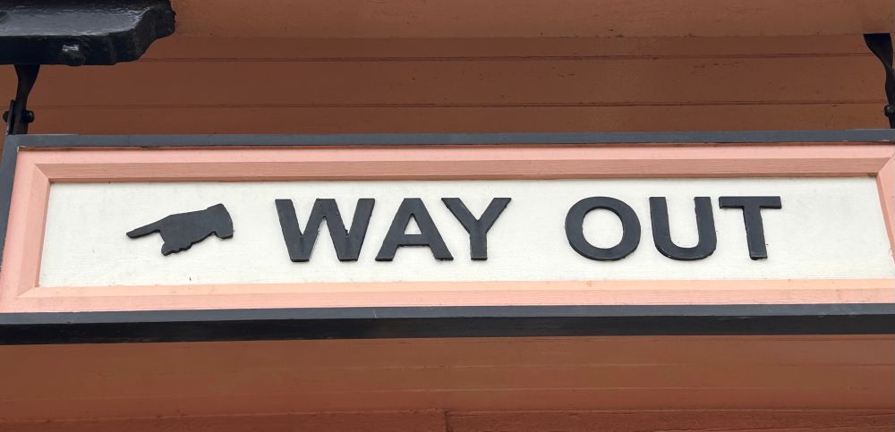way out sign with manicule