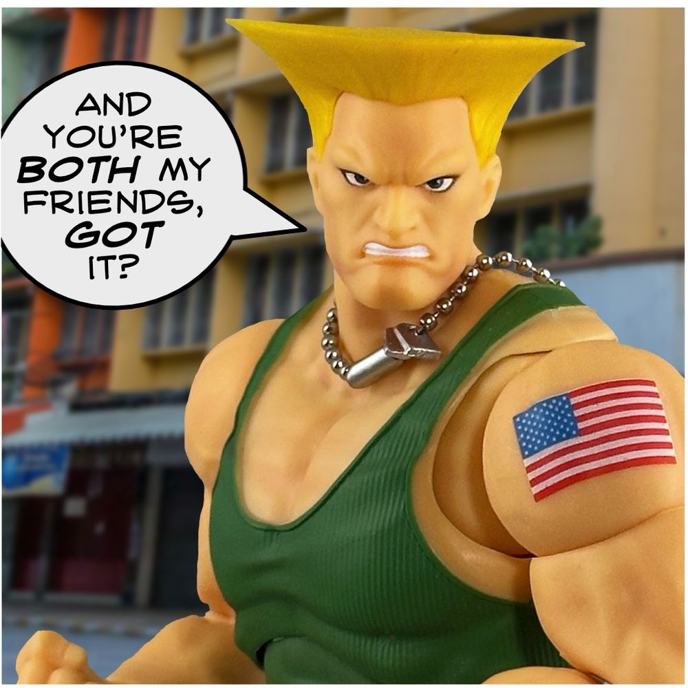 Guile in a more aggressive close-up, declaring, "AND YOU'RE BOTH MY FRIENDS, GOT IT?"