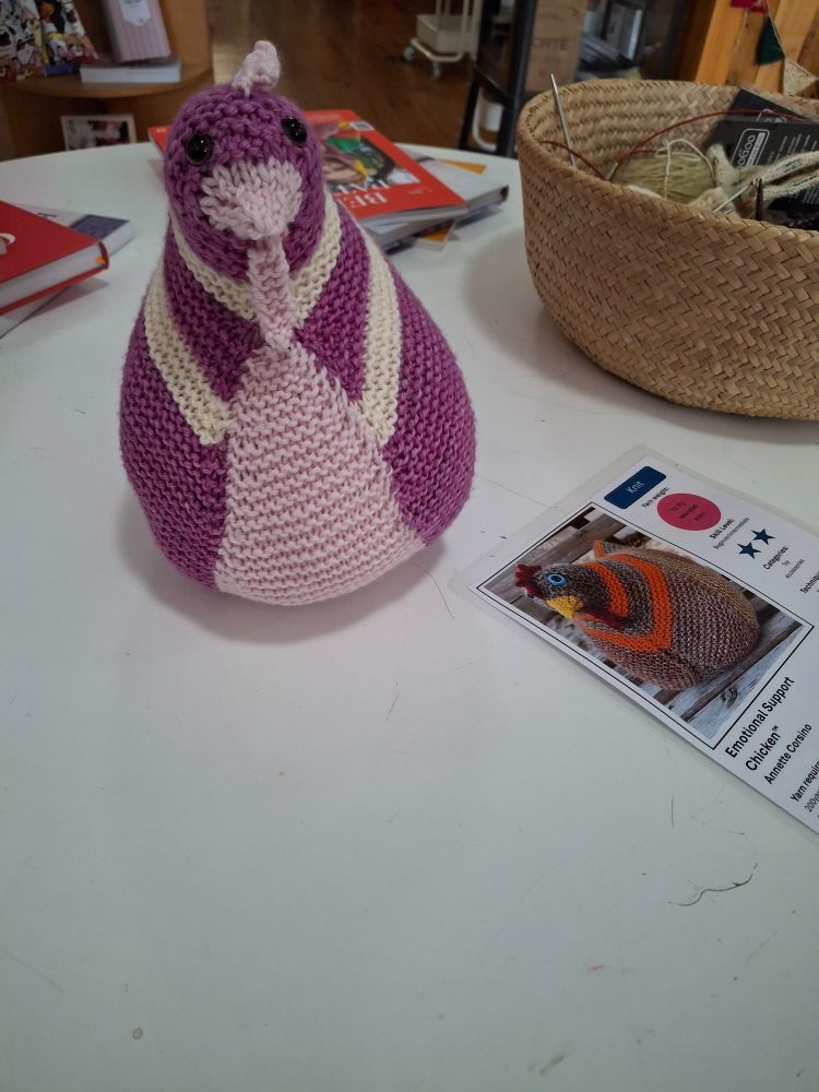 A pink and purple crochet chicken.