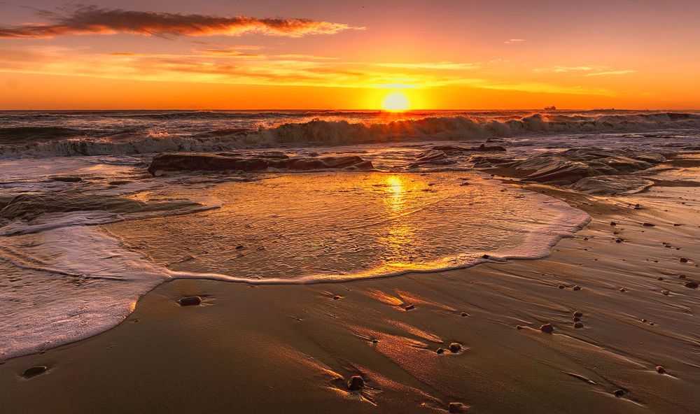 Sunrise on Whitley Bay beach in the UK.