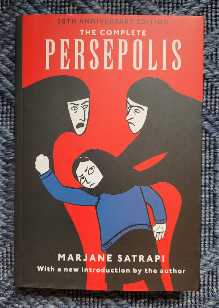 Photo of graphic novel The Complete Persepolis by Marjane Satrapi with an illustration of two women and a young girl.