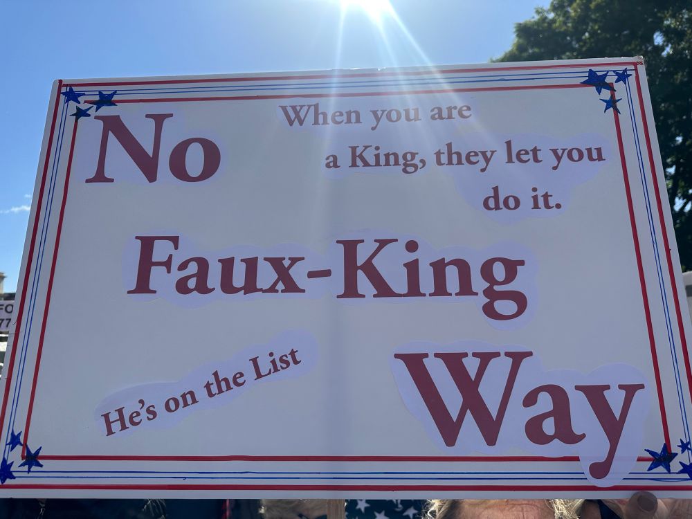 Sign that says, “He’s on the list.  When you are a king they let you do it” and “no Faux-king way”