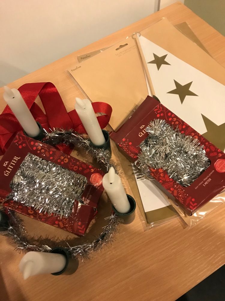 Glitter, candles in a crown and hats with stars for Swedish Lucia celebration